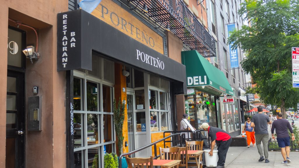 Exterior view of Porteño in NYC, showcasing its entrance and signage.