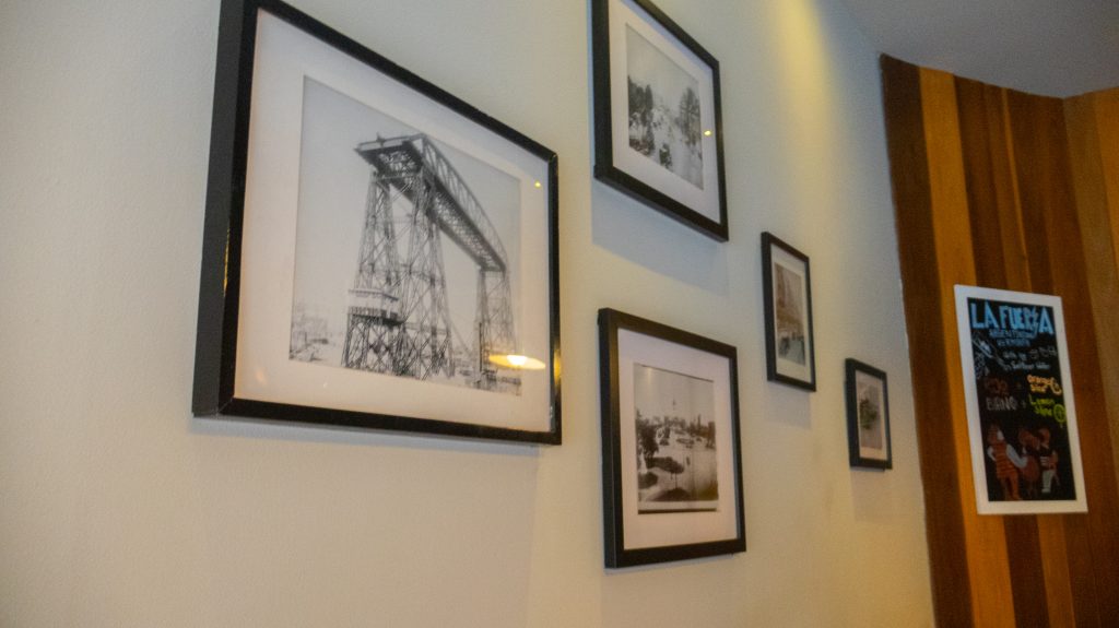 Wall with framed vintage photos at an affordable steak house in Manhattan