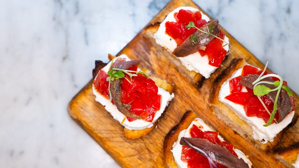 Tomato toast with Cheese herbs served