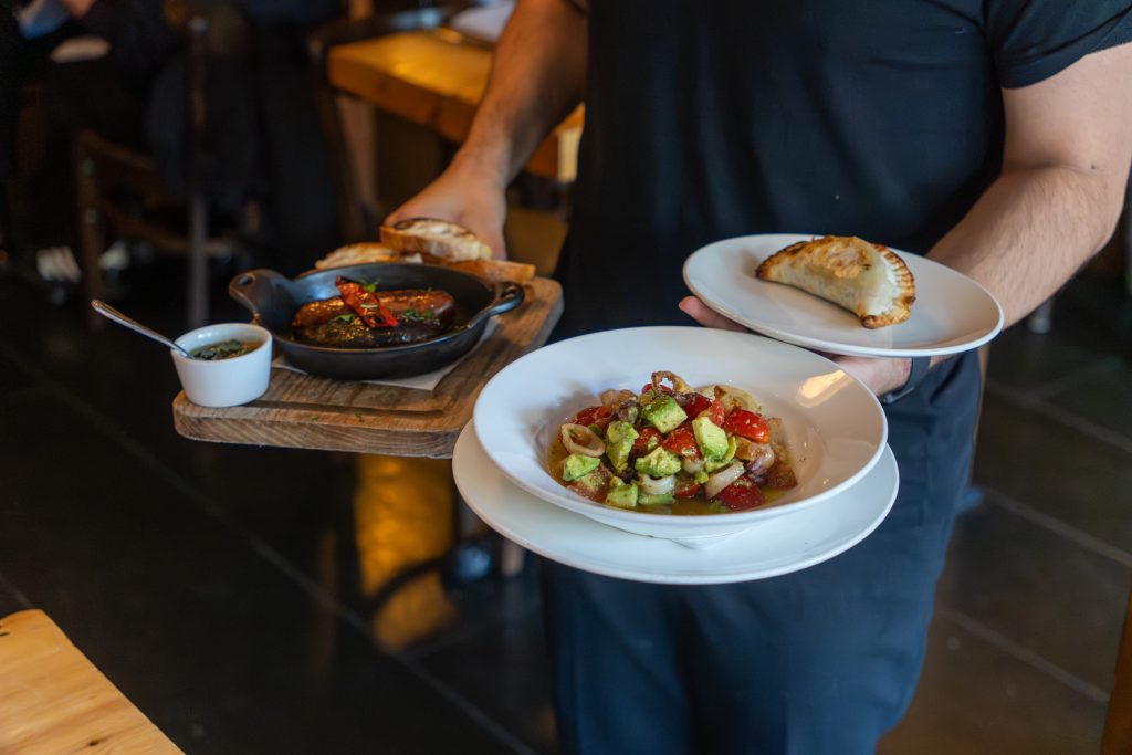 a squid salad and chorizo and empanada