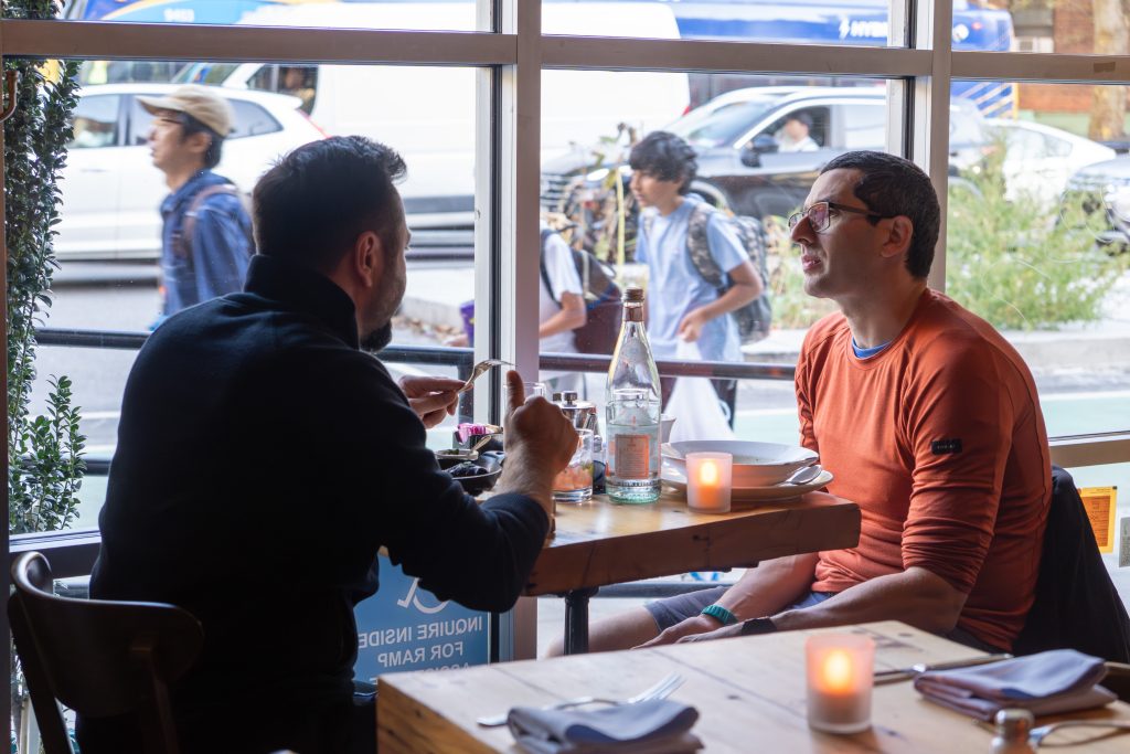 People enjoying dinner at Porteno.